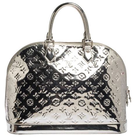 louis vuitton logo silver|louis vuitton silver u bag.